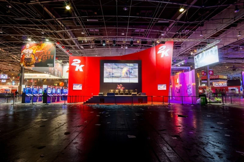 2K booth with its red central structure and presentation screen
