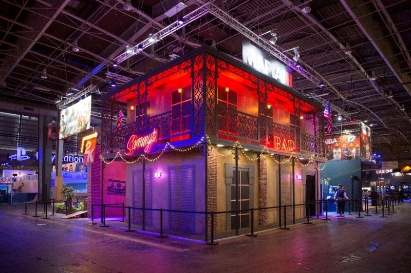 Mafia-inspired New Orleans street facade with a balcony and neon signs