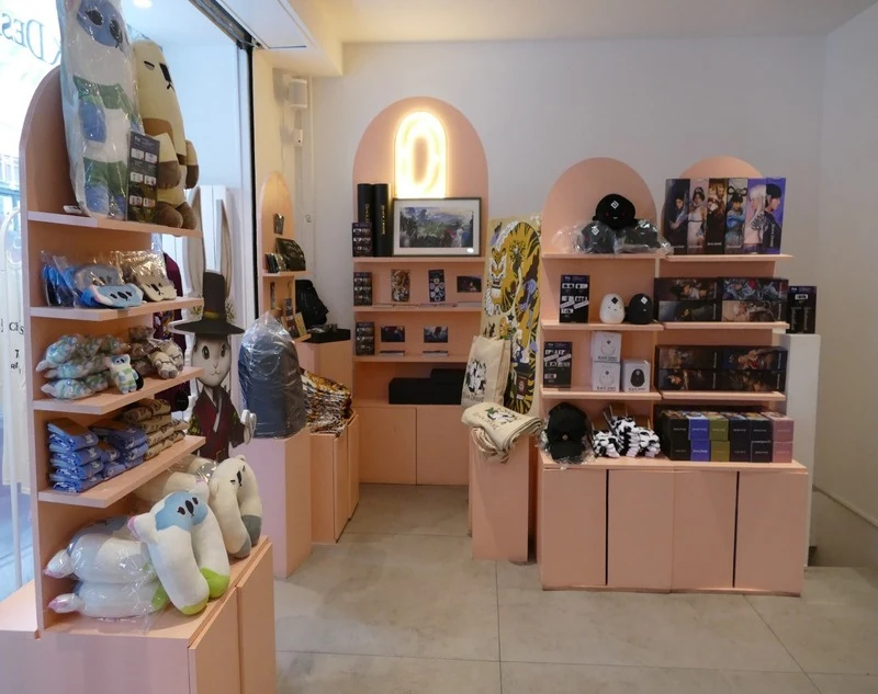 Black Desert display with merchandise and game artwork