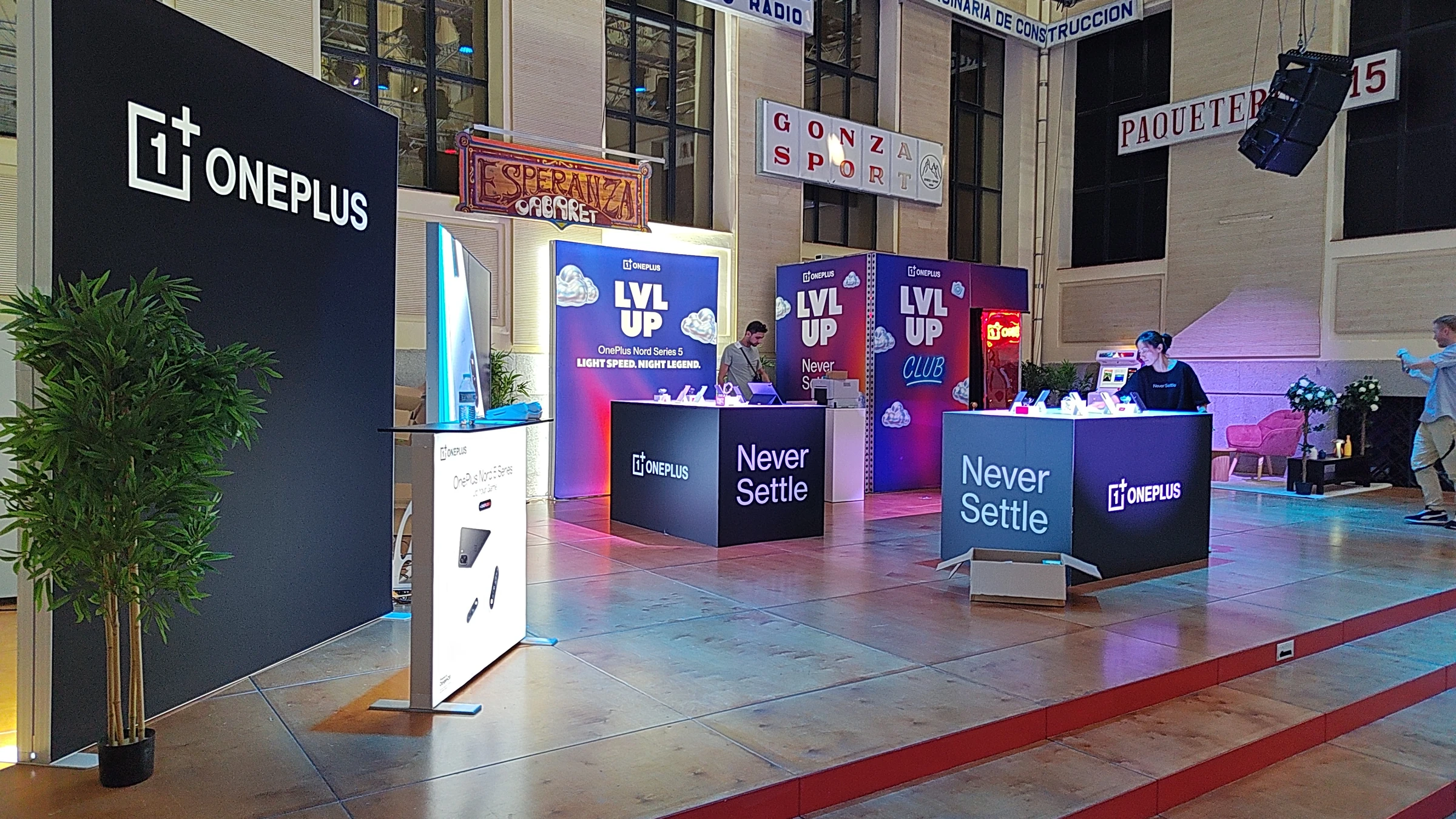 OnePlus pop-up store with illuminated smartphone demonstration counters