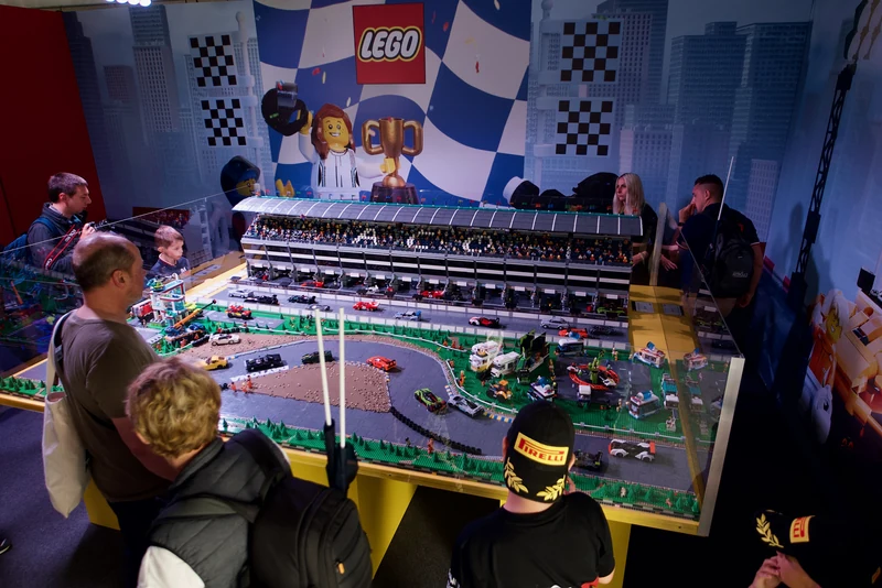Visitors viewing a LEGO motor-racing circuit model