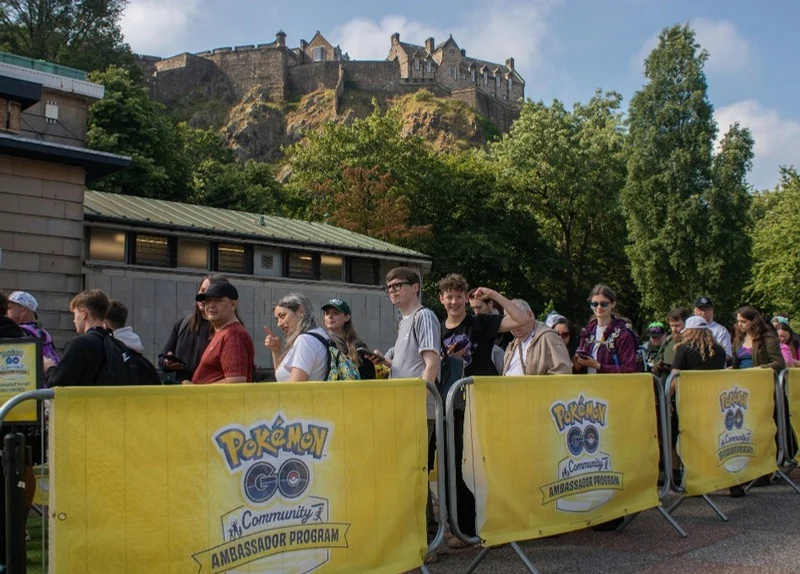 Pokemon GO fans alongside branded crowd barriers